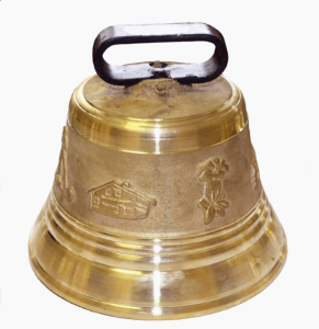 Cloche de vache en bronze avec une inscription