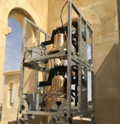 Church bell equipped in their metal belfry for export