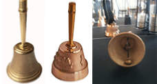 Bronze tables bells with a metal handle
