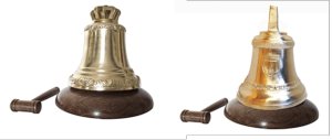 Paccard bell in bronze presented on a wooden base