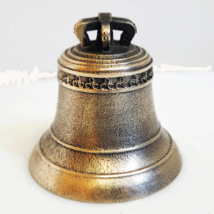 Decoration of a bronze bell with a triskel frieze